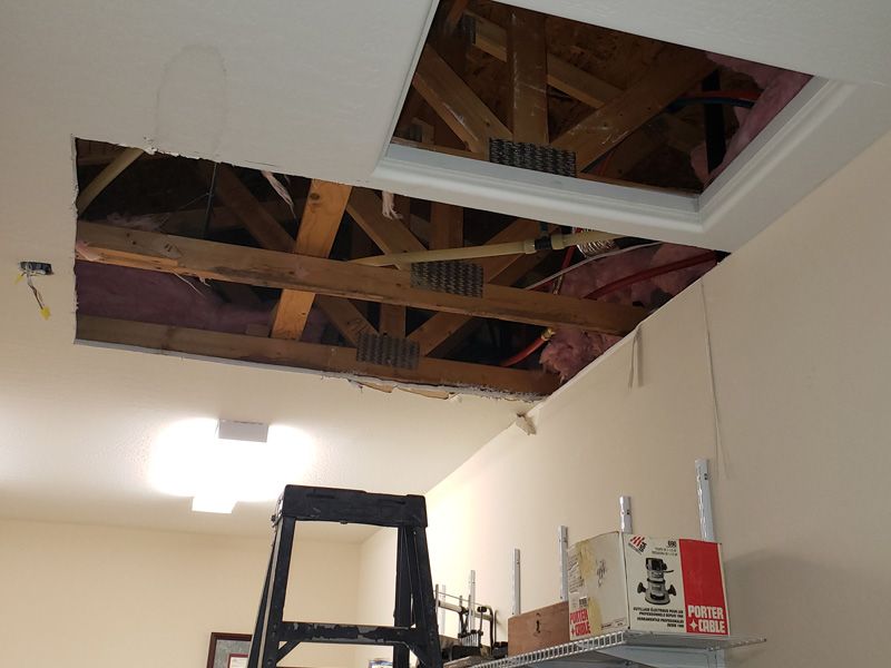 Collapsed ceiling from damaged pipes